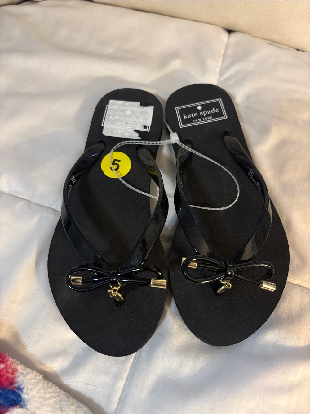 kate spade Black Bow Jelly Flip Flops with Gold Accents